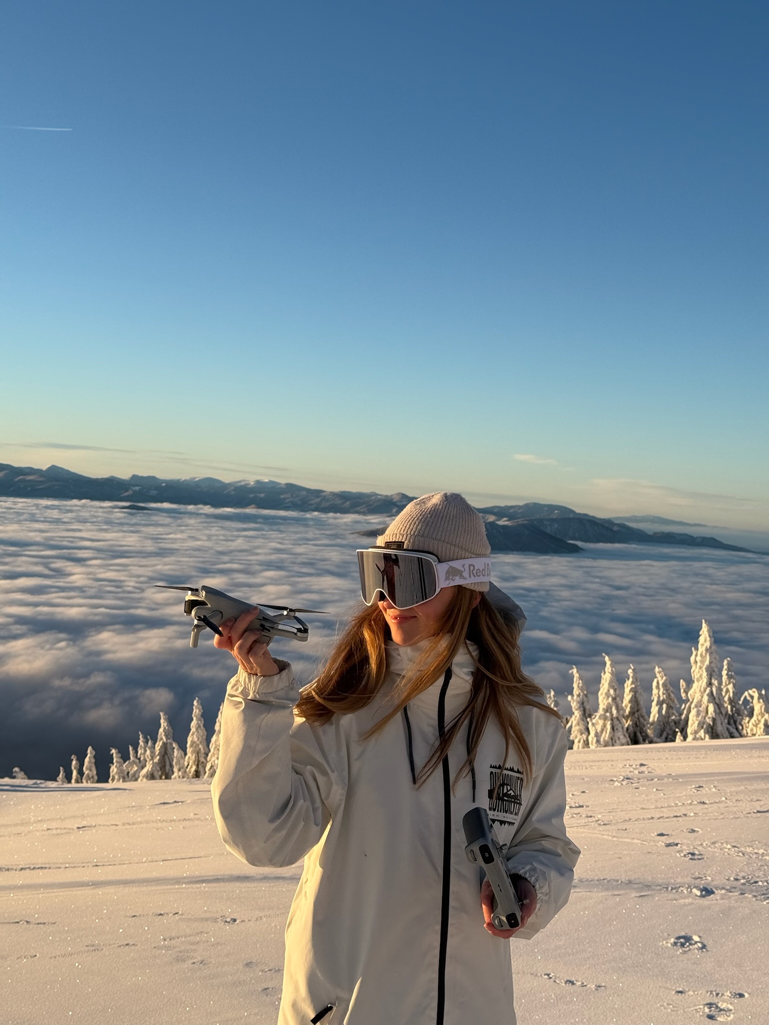 A visitor enjoying the winter mountain view at Kubínska hoľa
